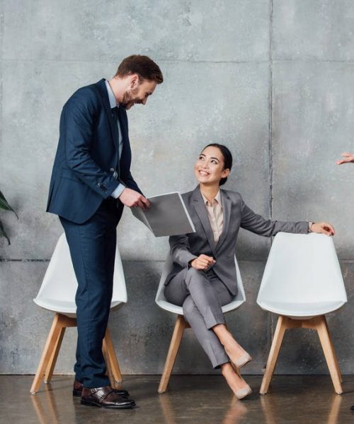 stock-photo-smiling-multiethnic-businesspeople-having-discussion